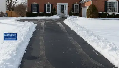 Cleared residential driveway after professional snow removal by Chop Chop Landscaping in Overland Park, KS