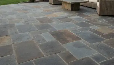 Flagstone patio with natural slate pavers installed by landscaping pros in Overland Park, KS
